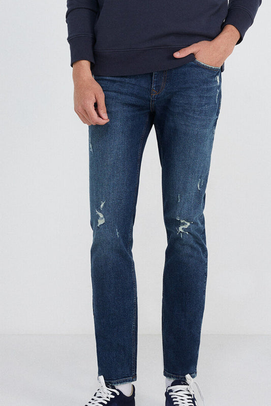 Medium-dark wash slim fit jeans with rips