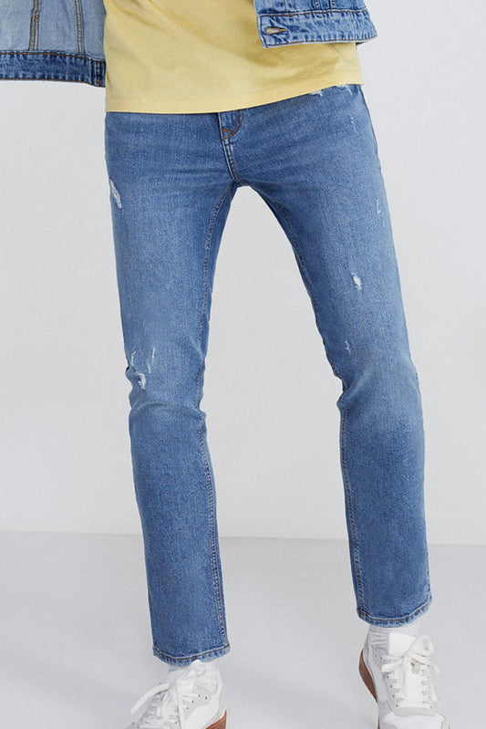 Medium wash slim fit jeans with rips