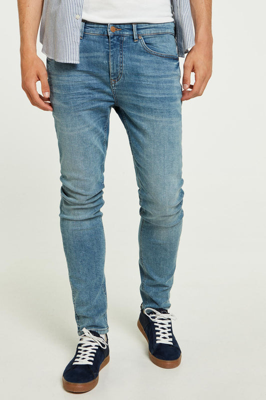 Medium wash distressed skinny jeans