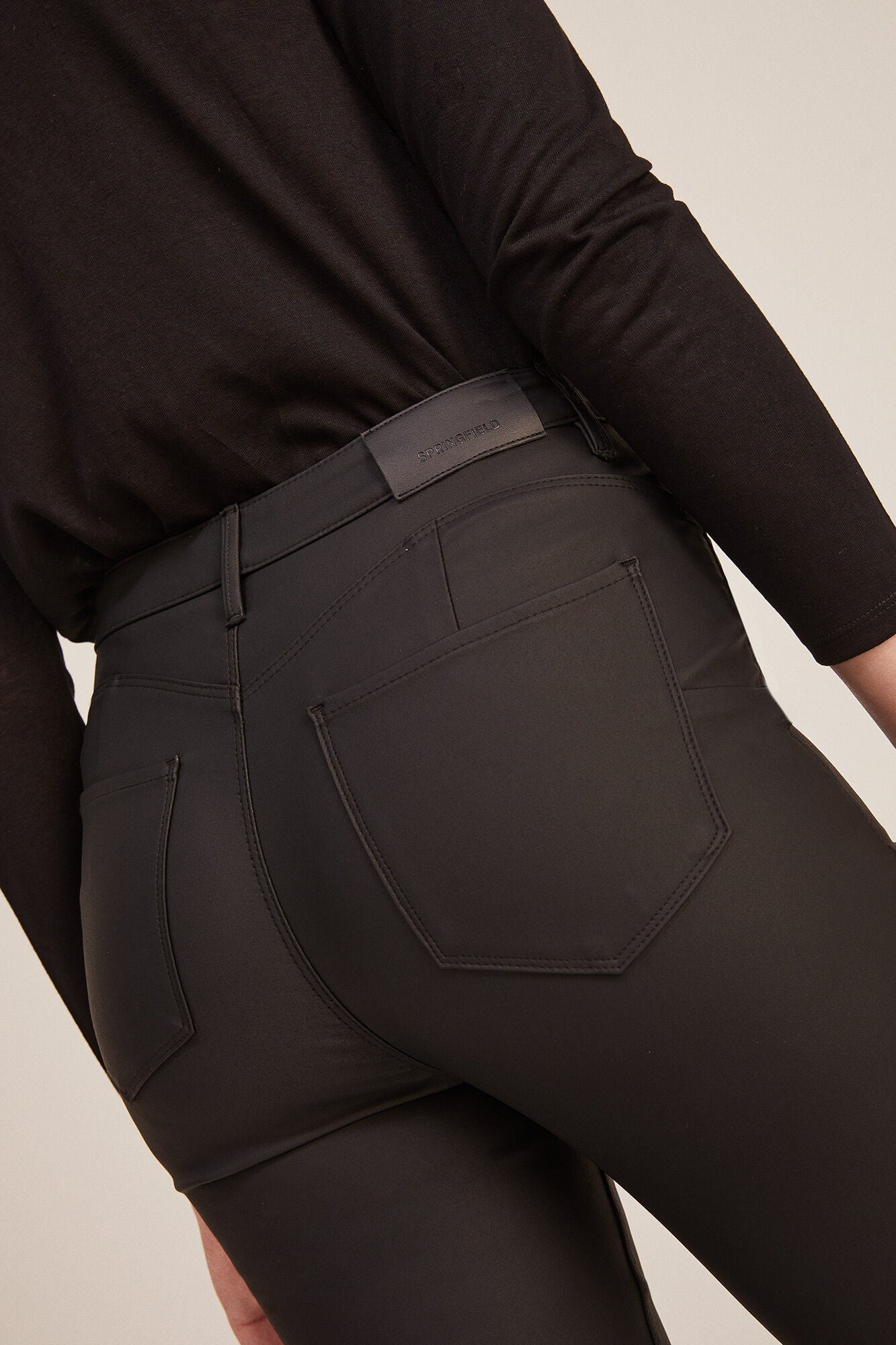 Coated push-up trousers